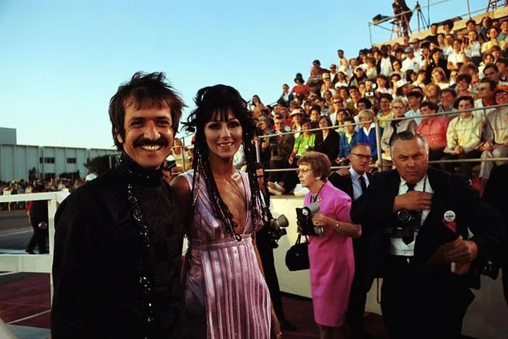For her first Oscars appearance, Cher attended alongside Sonny Bono in a pink and metallic satin gown. To take it up a notch, the singer subtly braided some pink and gold fabric into her hair to match the dress. Photo: Getty 