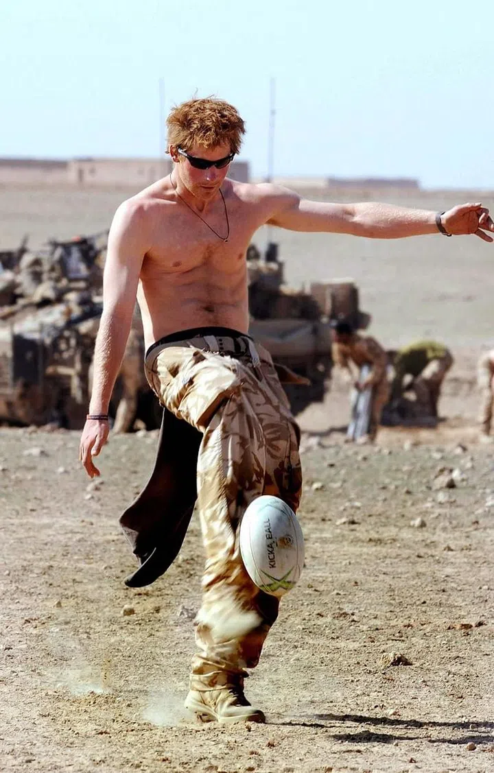 Hi, this is just a picture of Prince Harry playing soccer shirtless with a six pack, don't even worry about it, just enjoy it. It was clearly taken around the same time as that motorcycle pic, a beautiful moment in Prince Harry's personal (t)hi(r)story.
