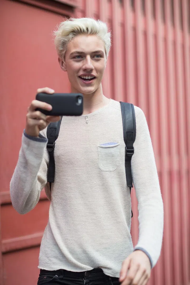 MILAN, ITALY - JUNE 21: Model/Musician Lucky Blue Smith exits the Salvatore Ferragamo show and shoots a video of the photographers on June 21, 2015 in Milan, Italy.  (Photo by Melodie Jeng/Getty Images)