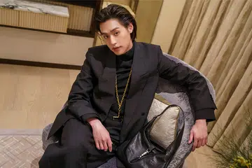 billkin wearing gucci suit sitting in hotel room | billkin gucci spring summer 2026 event singapore