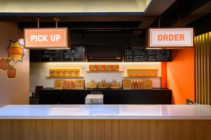 The pop-up by Coach and Two Men Bagel is inspired by a traditional New York City bagel shop and allows visitors to purchase food and fashion under one roof. (Photo: Coach)