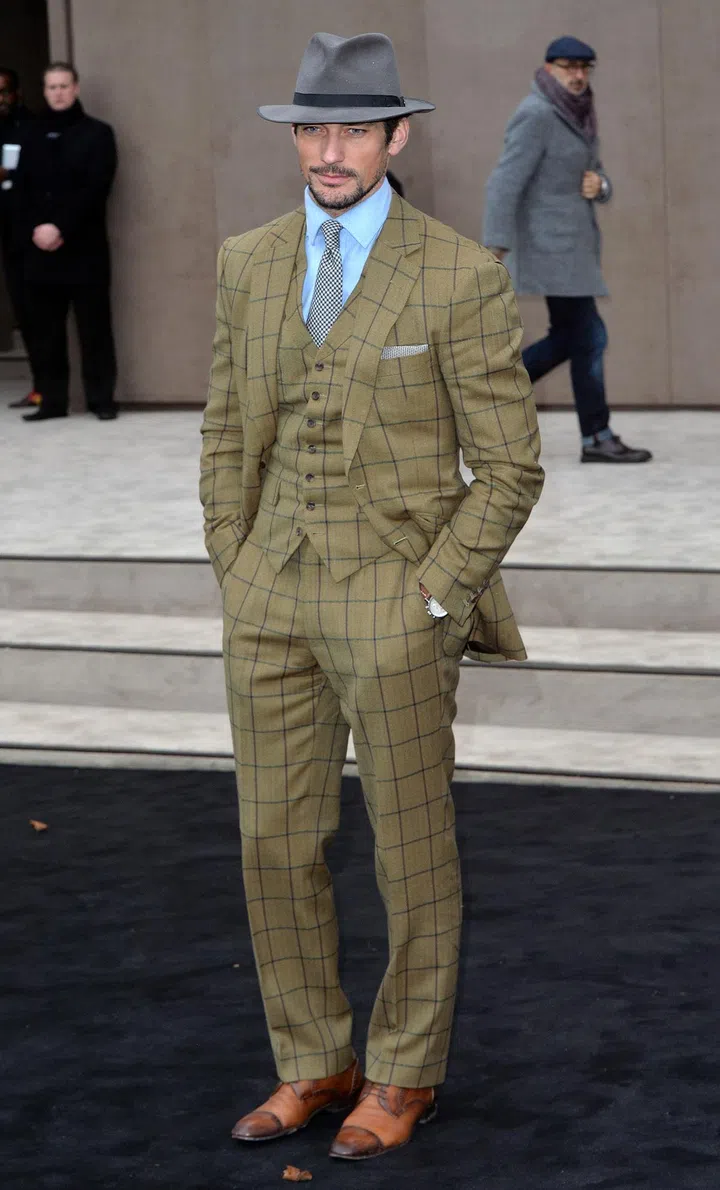 It is very rare that you will see Gandy in a black suit; in fact, he's more often than not in tweed, pale blue or grey.