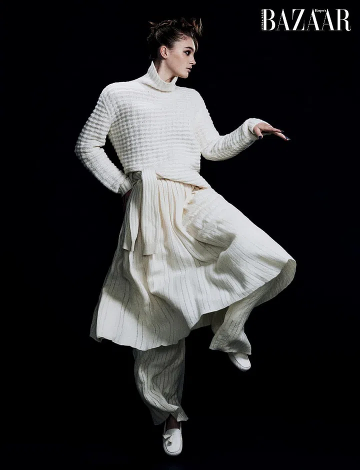 Sweater; sweater (tied around waist); skirt; trousers; loafers, Loro Piana.
