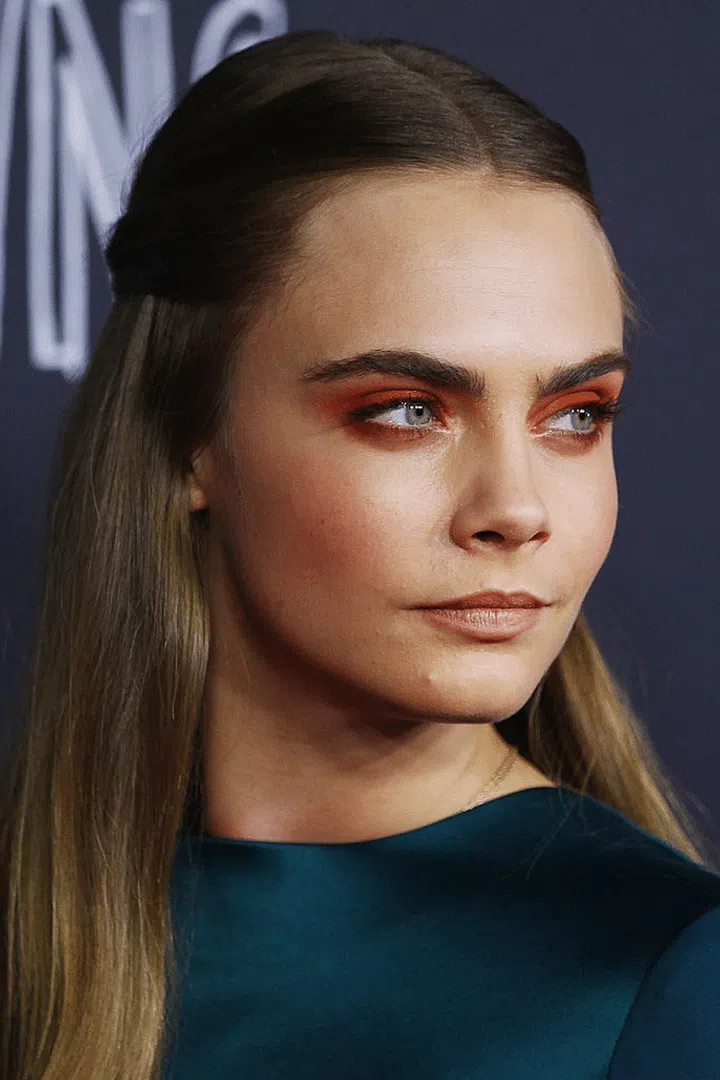 Mermaid-esque in neon orange eyes and lips.