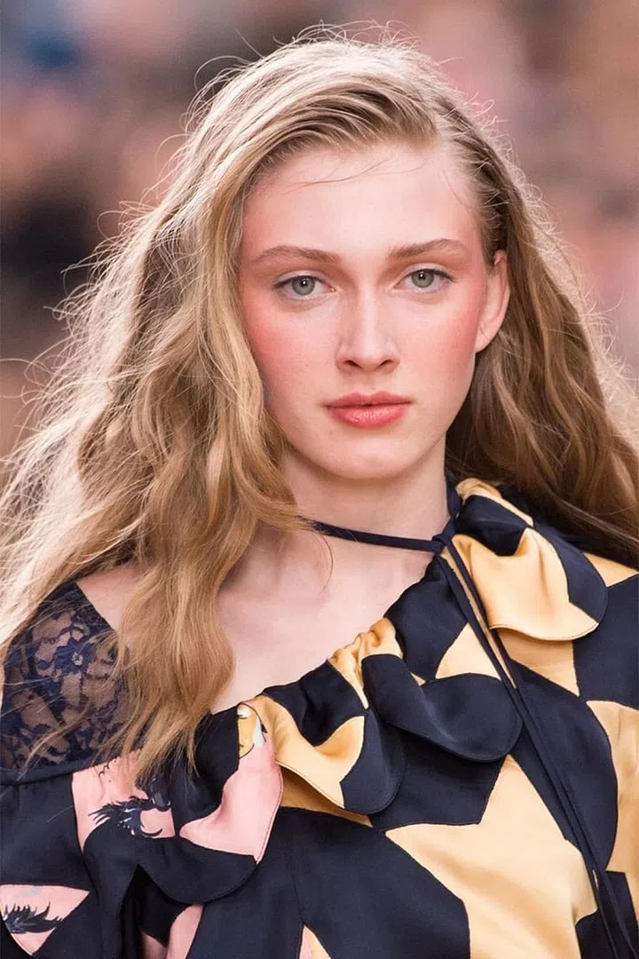 The inspiration for the beauty look at Nina Ricci was a book called Rodeo Queen, which chronicled cowgirls at rodeo circuits in the '80s and '90s. So you can imagine that the beauty look could have gone really wrong, really fast. But hairstylist James Pecis managed to get the height, curl, and volume that we've come to associate with the wild west—but without any of the stiffness or crunch. The key product? You probably already guessed it: mousse. If the hair looked too perfectly curled, Pecis and his team would break it up with water for a fuzzier, softer feel.