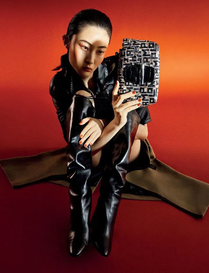 Roseau Jacquard LGP Crossbody bag, $730; trench coat, $3,110; boots, $1,460.