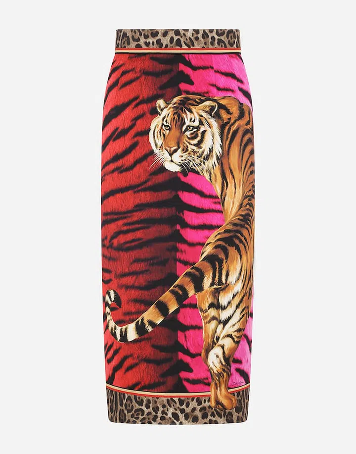 Charmeuse midi pencil skirt with tiger print, $1,700, Dolce&Gabbana