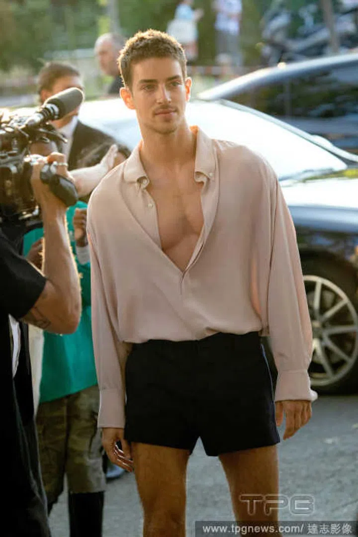 Manu Rios balances out short shorts with a long-sleeved shirt.