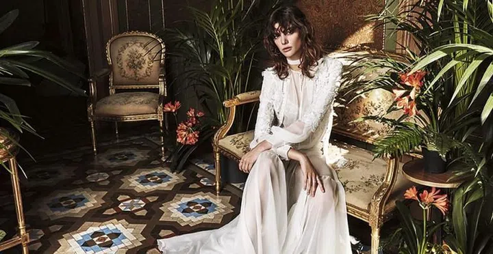 Family business Yolan Cris was launched by Barcelona-based sister duo Cristina and Yolanda, who manage the design and business behind the brand respectively. The sisters grew up in a bridal salon–their mother owned a gown shop in Spain–and so they understand as well as we do how over-saturated the wedding world has become. The sameness of bridal fashion can make anyone go ivory blind; and over time gowns seem to merge into one large meringue of tulle, lace, beading and pleats. That's why this label seems to understand the importance of creating gowns with personality, intention and a point of view. Yolan Cris is packed with polarizing styles that pack a punch and instantly speak to an individual, an aesthetic and an individual style sensibility. If you're after something regal, be it neo-Victorian, opulent and glamorous or a touch gothic, they get you. If you're after something sexy and sultry, they have that too; and if you're thinking you're more of a free-spirited boho, you're covered. You won't be starved for options with this brand, both their bridal and evening collections are expansive, but minimalism is in no way part of their vocabulary. The one through line? Each gown is designed with unexpected fabrics, never-before-seen laces, brocades and silks and delivers a fresh point of view to the bridal mix.