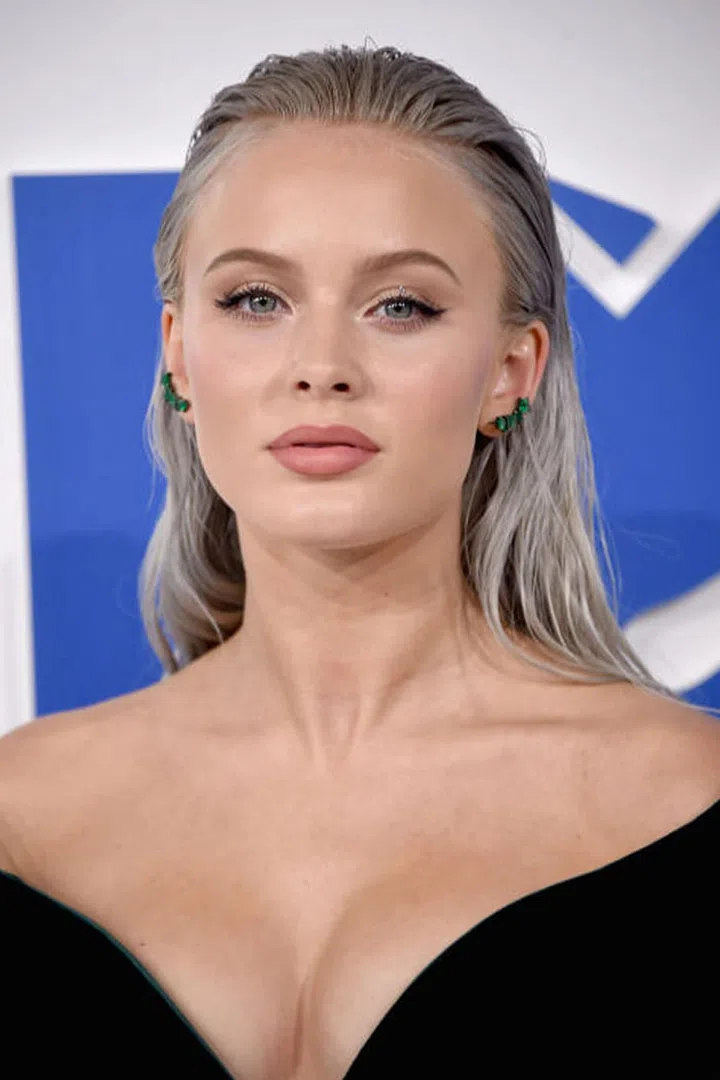 There's no doubt Larsson has her mind on the money considering she literally dyed her hair to match dolla, dollas bills. 
