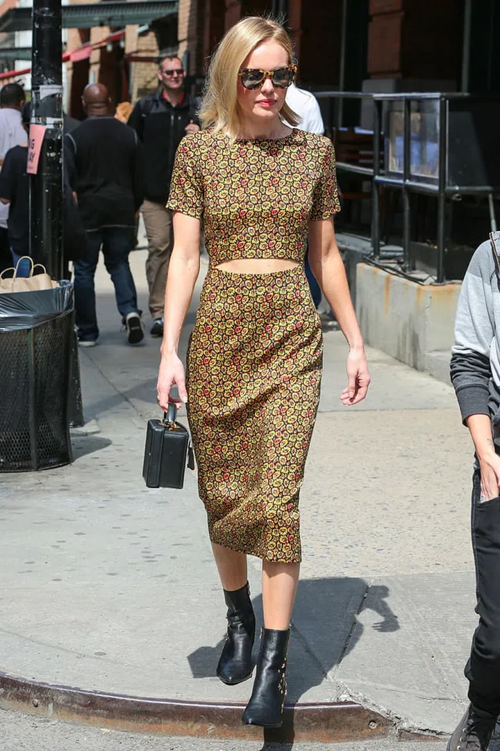 Because you're small, carrying around a big bag will make you look even smaller. So make like Kate Bosworth and invest in a small box bag instead of something oversized (and just be stricter with your essentials).
Photo: Getty