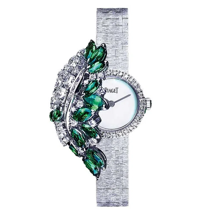 Based on the sunny weather and tropical palm trees of Palm Springs, California, "The Sunny Side of Life" watch from Piaget keeps time hidden from view under swaying palm leaves depicted with diamonds and emeralds. The textured white gold bracelet is set with 13 marquise-cut emeralds, 57 brilliant cut diamonds, and eight baguette-cut diamonds, elegantly throwing shade over the discrete mother-of-pearl dial.
Price Upon Request. piaget.com