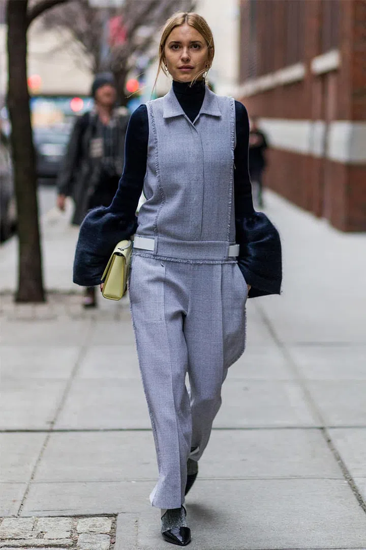 We all know workwear doesn't have to be dowdy, but this street style star is proof that you can actually work the most daring of trends into you office wardrobe. Exaggerated sleeves, athleisure and clever layering are all proof.