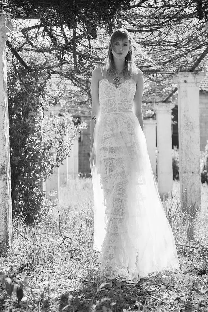 Tiered skirts layered with soft tulle and 90's slip-esque feels easy enough for laid-back settings, while also adding visual interest to a slim silhouette. Costarellos BR18-30, costarellos.com. 