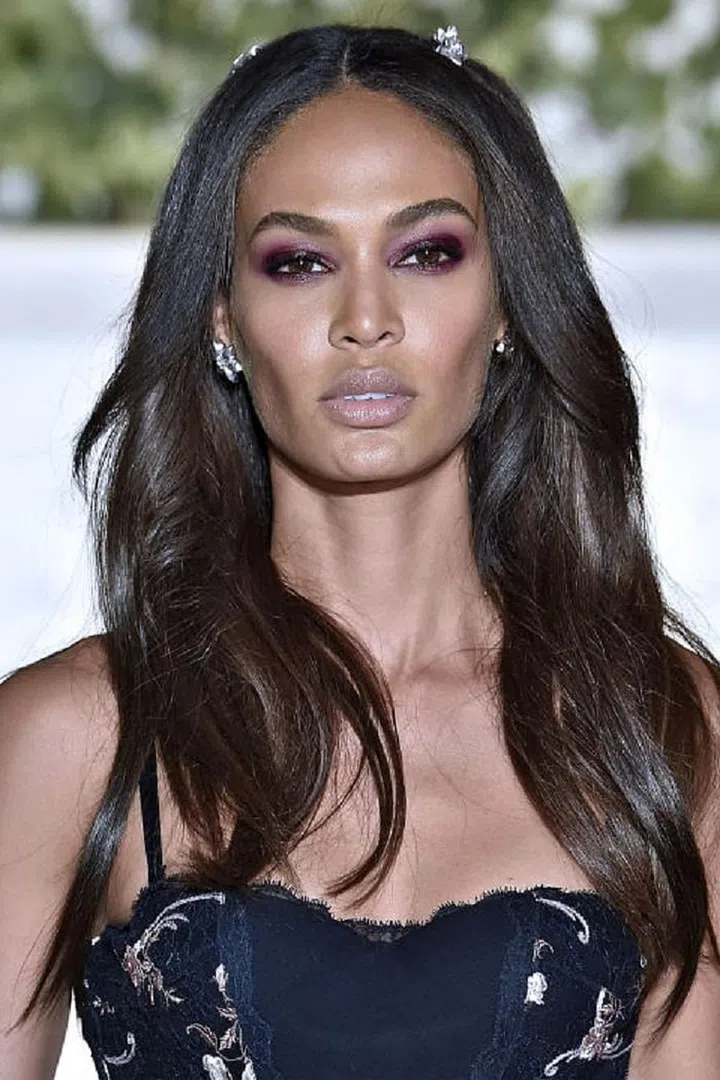 "Shades of purple have the ability to make deep brown eyes appear more golden," states Wilson. For an easy wash of color, swipe a plum shade across your lids and use a neutral color (like your bronzer) in the creases. Or, swap out your traditional black pencil for one in eggplant. "It's dark enough to frame the eyes without screaming purple," explains Wilson. Pair it with neutral shadows or with a smoky eye. Photo: Getty 