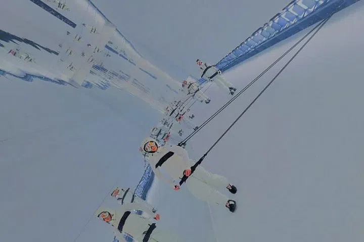 Models “skiing” on the wall at Moncler Grenoble’s creative installation space.