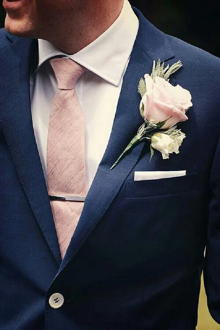 Your groom and groomsmen will look especially dapper with boutonnieres and ties in this shade of pink.