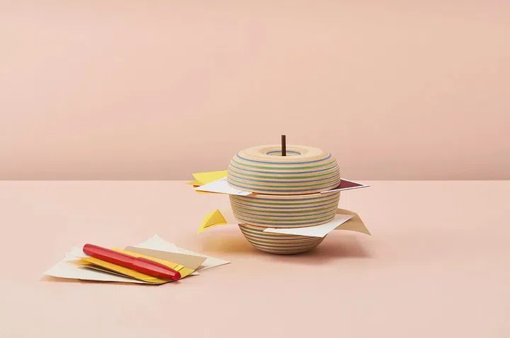 Here's a colourful way to store your cards and loose memos. This apple-shaped cardholder is made with three stacking parts that allows for insertion of cards and memos. It is made of paper-wood, a plywood that involves the lamination of coloured recycled paper and Hokkaido-grown wood. 
Available at Supermama
