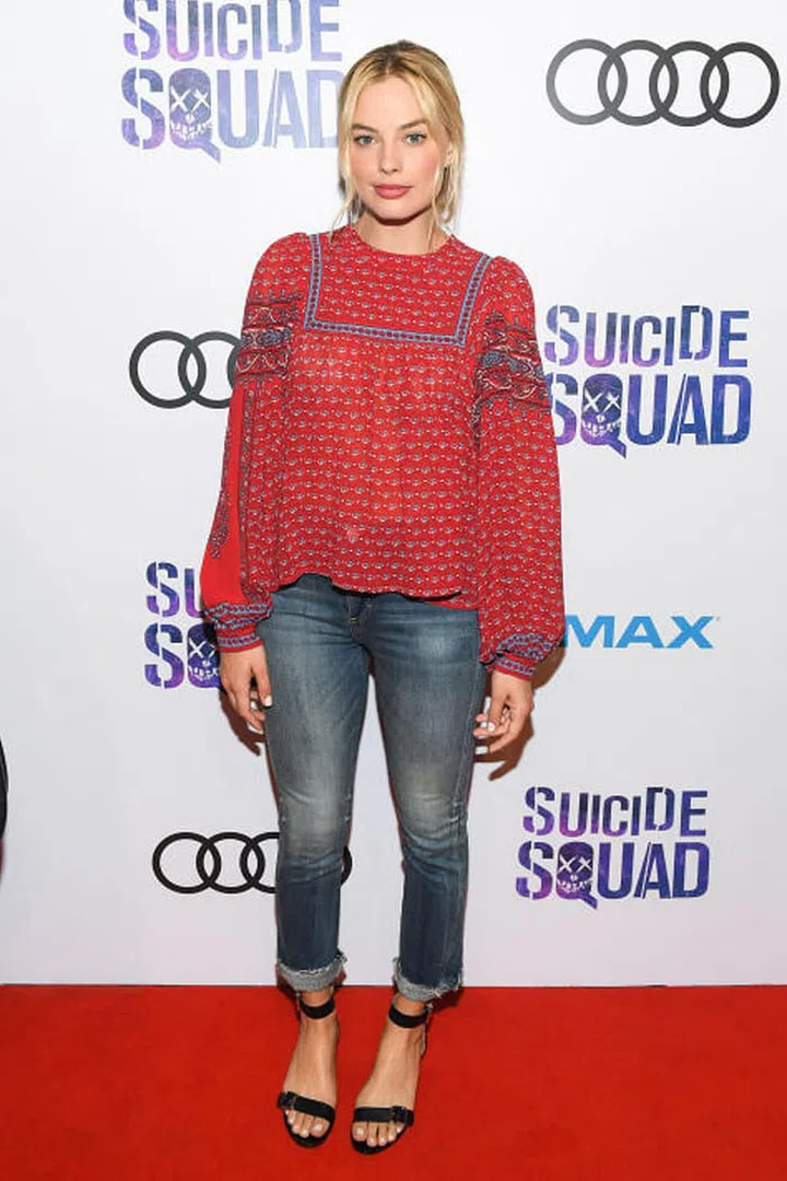 Margot Robbie in a red top and cuffed jeans while promoting the movie in Toronto.Photo: Getty