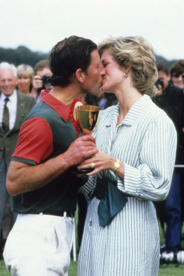 Kissing after a polo charity match in Winsor. Photo: Getty 