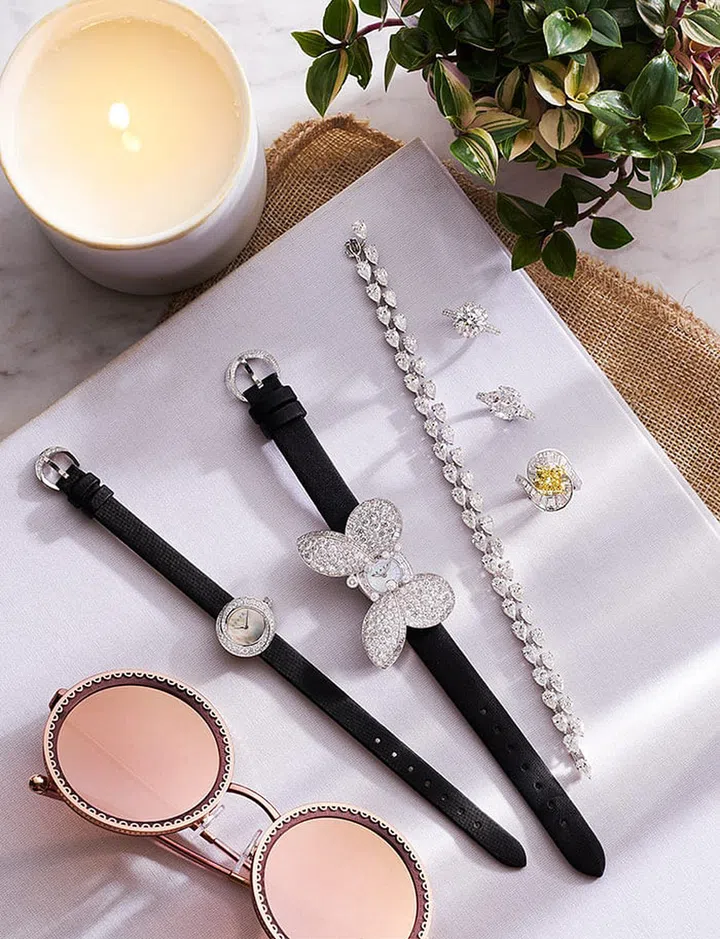Clockwise from left: GRAFF Spiral diamond watch; GRAFF Princess Butterfly diamond watch (13.69 carats); GRAFF pear-shaped diamond bracelet (18.38 carats); GRAFF Icon ring with 2.13-carat round-cut diamond; GRAFF Promise ring with 3.02-carat cushion-cut diamond; GRAFF Swirl ring with 4.42-carat radiant-cut yellow diamond (11.73 carats).