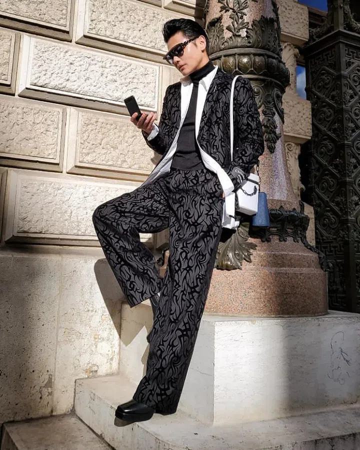 Kenneth Goh snapped wearing a Dior look.