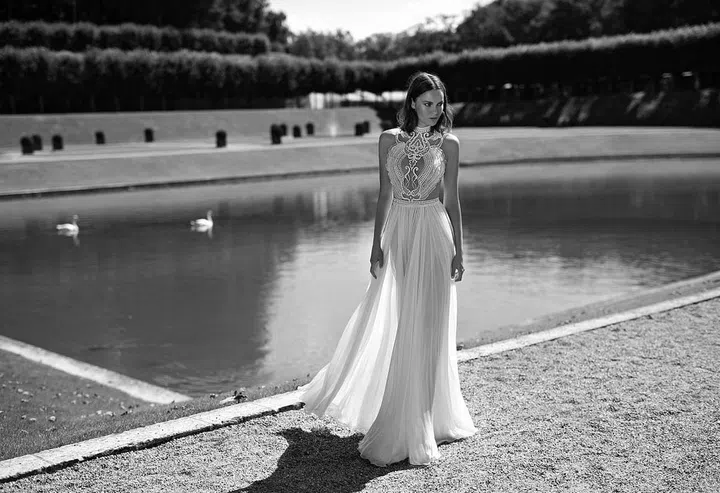 A graduate of the workrooms of Alexander McQueen and Roberto Cavalli, Tel Aviv-based Alon Livne blends drama, detail and sex appeal for designs that range from ethereal to jaw-droppingly dramatic. Always conscious of the female form and finding new ways to approach appliqué, this designer is a refreshing addition to the bridal scene. Almost never working in soft ivory, opting for more of a vibrant white, Livne's gowns strike the balance between the aisle and the red carpet–ideal for the woman looking to make the most of her moment in the limelight.