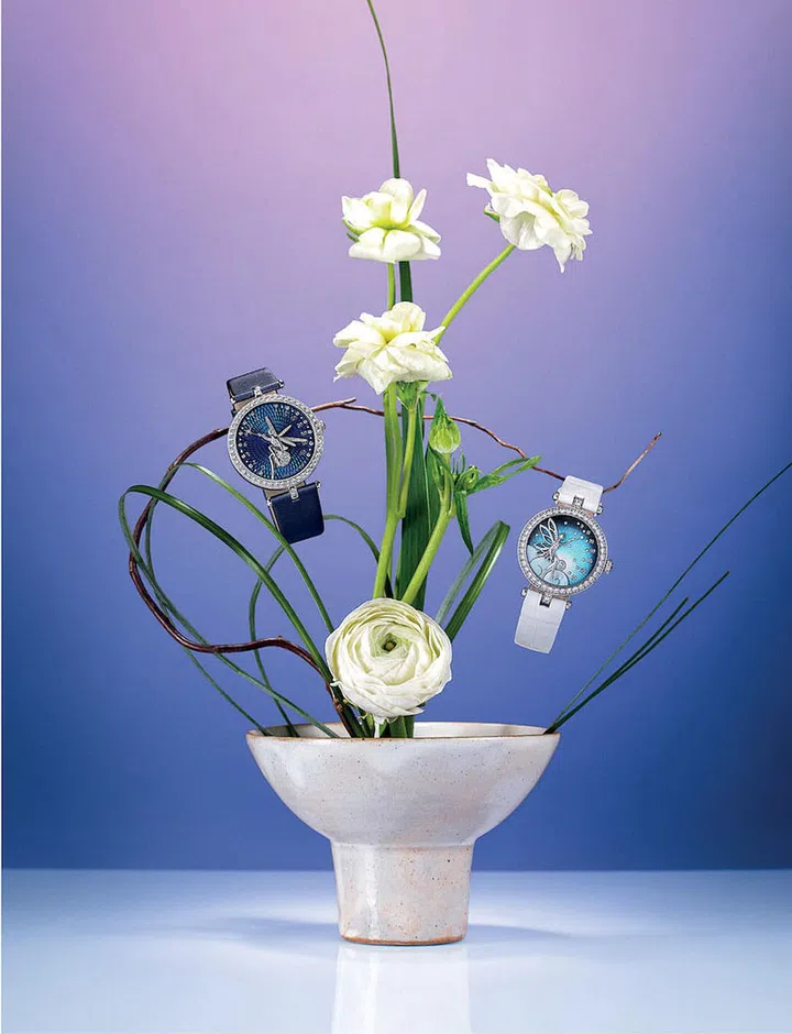From left: White gold and diamond Lady Arpels Féerie watch; white gold, sapphire, mother-of-pearl and diamond Lady Féerie watch, both by Van Cleef & Arpels. (Photo: Hosanna Swee)