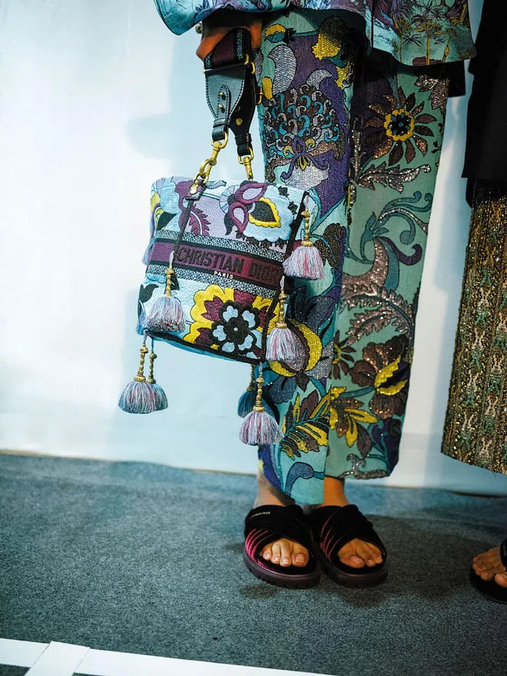 Intricate details on a matching bag and trouser set. Photo: Dior