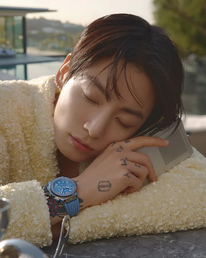 harper’s bazaar singapore june 2026 cover story | jung kook wearing bottega veneta jacket and Big Bang Original Titanium Coal Blue watch by pool