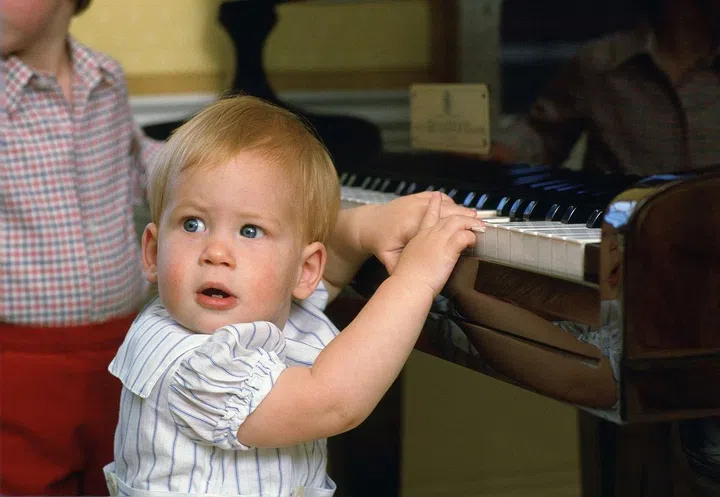Prince Harry, 1, plays the piano at home in Kensington Palace.