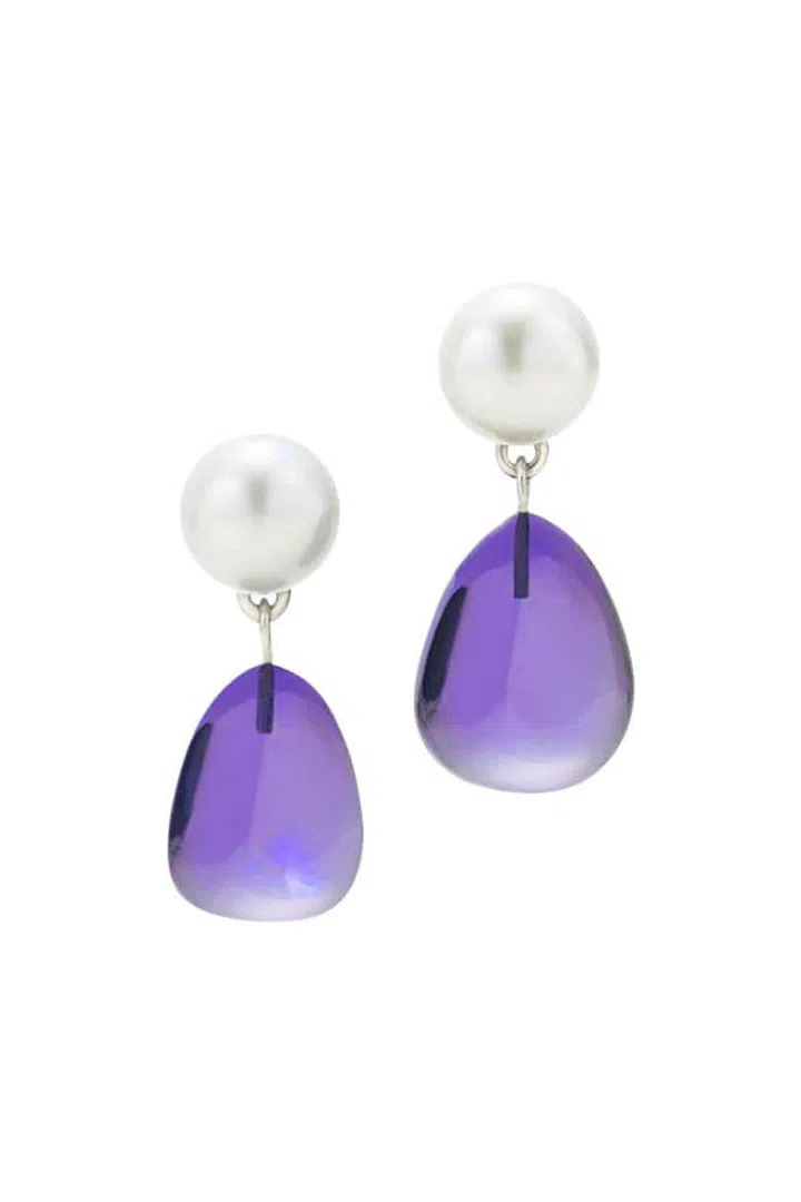 [Eye-a-lite] n. From the Greek ios, meaning violet. The stone is also sometimes referred to as water sapphire thanks to its pale blue shades. Iolite was used by the Vikings to protect their eyes from sun glare. Don't try that with your earrings at home.
