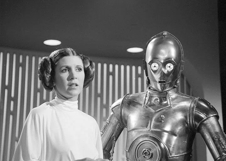 A piece of fashion history died with Fisher. The American actress helped bring to life the iconic daughter of one of 20th-century cinema’s greatest villains, Darth Vader. 
Her influence on fashion and beauty knows no bounds. Who can ever forget Princess Leia’s hair—inspired by the Native American women from the Hopi tribe—and the iconic metallic outfit she wore when she was enslaved by Jabba the Hutt in Star Wars: Return of the Jedi?