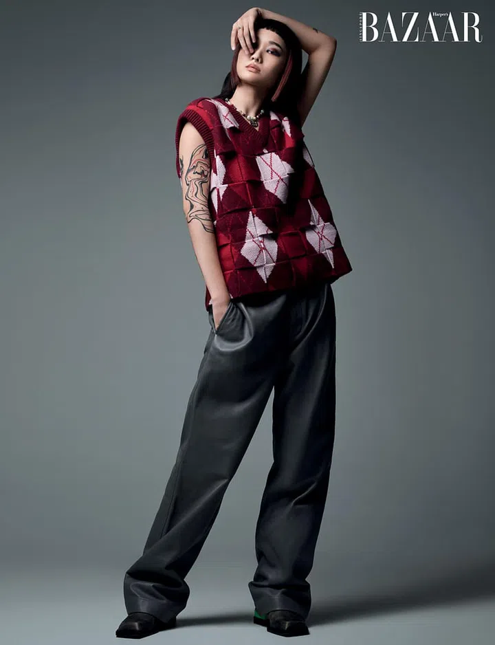 Sweater and trousers, Bottega Veneta. Steven Ma boots and necklaces, her own