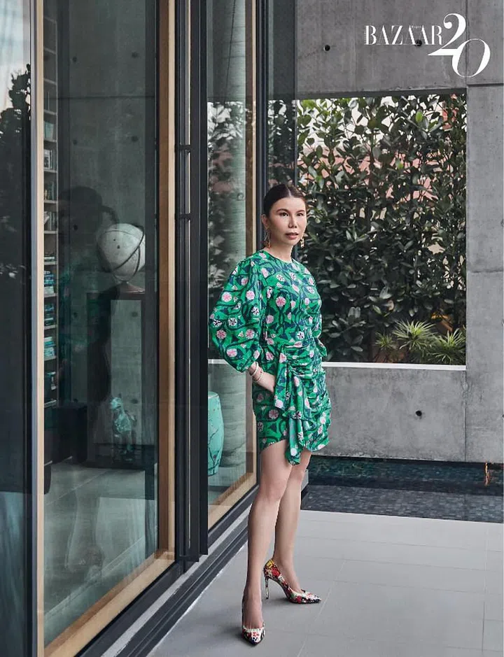 Chuah on the floating platform in her Rhode dress, Christian Louboutin heels, Chanel earrings, and bangles by Cartier and Tiffany & Co. 

Photo: Phyllicia Wang