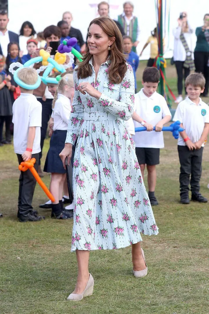 Kate Middleton unveiled a new playground inspired by her Chelsea Flower Show garden at RHS Wisley in Surrey, opting for a light blue Emilia Wickstead midi dress dotted with pink roses. Featuring a collar, long sleeves, and a cinched waist, the number was classically Kate. The duchess paired the look with espadrille wedges for the outdoor event.