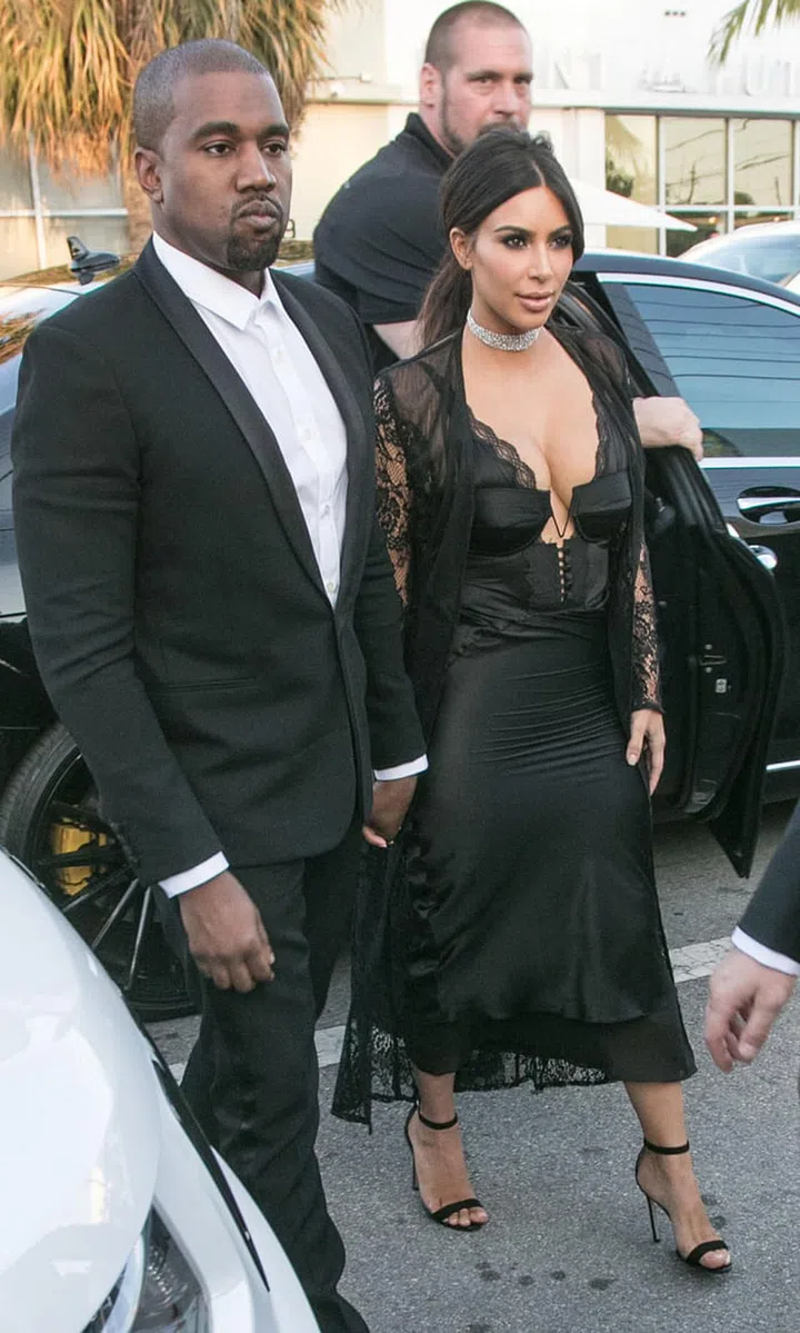 The reality star did her best to upstage the bride in this revealing black dress. Photo: Rex Features
