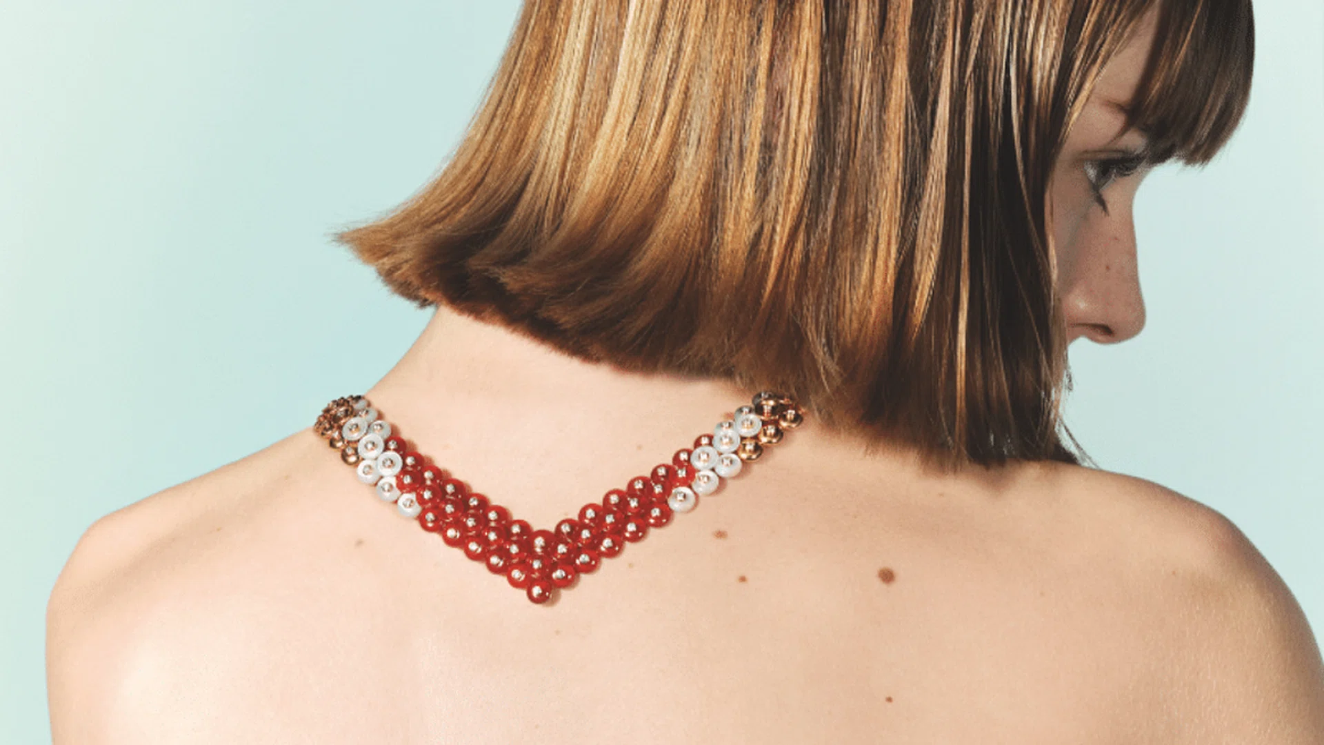 Rose gold, diamond, carnelian and mother-of-pearl Bouton d’or necklace, $145,000; rose gold, diamond, carnelian and mother-of-pearl Bouton d’or ring, $26,800, Van Cleef & Arpels. Photo: Stefan Khoo
