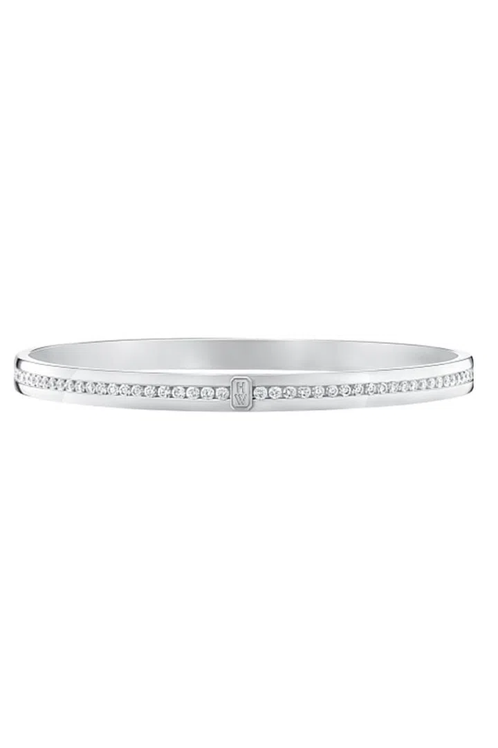 Wear this Harry Winston white-gold logo bracelet on its own or stacked. 
