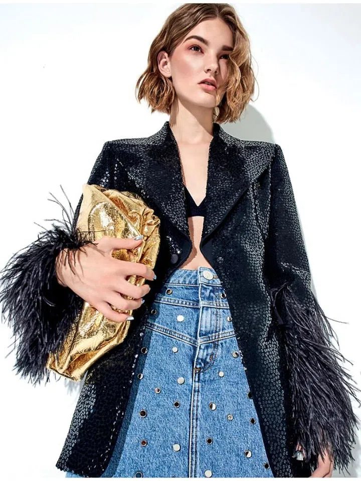 Blazer, Michael Kors Collection. Skirt, Sandro. Clutch, Bottega Veneta. Bra, stylist’s own.