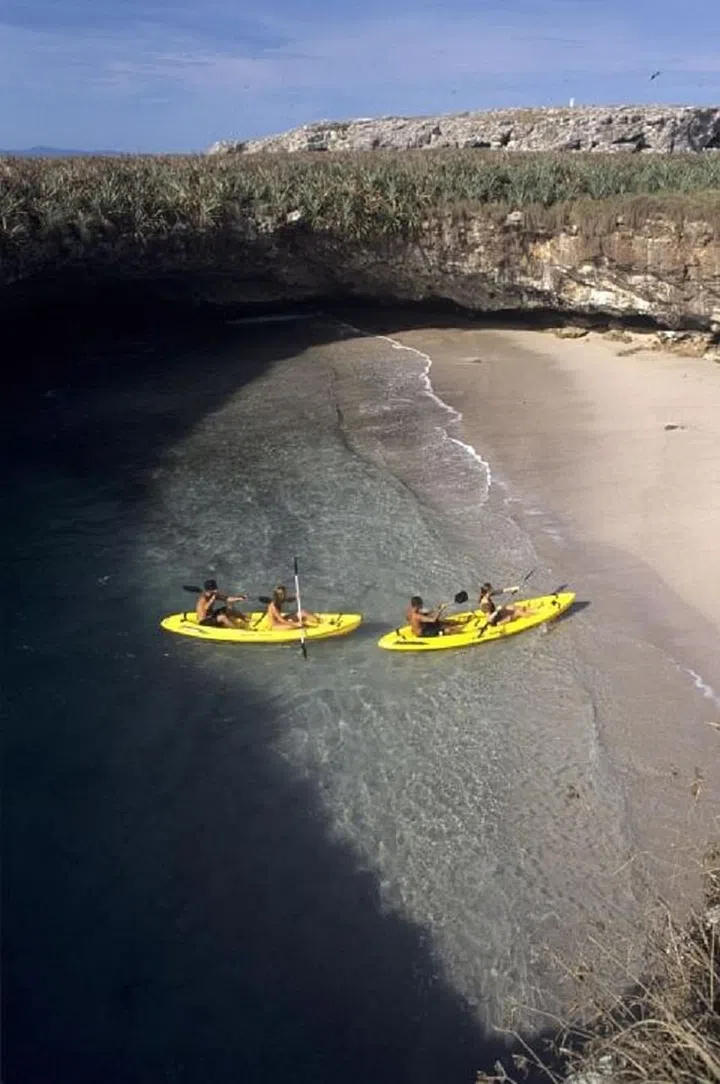 You might notice that there's a lot of land surrounding this beach - so how do you actually get to this wonder? You have to swim underwater through a short tunnel that connects to the hidden beach. Photo: Getty 