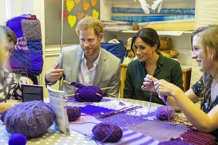 They sat and talked with workers of the charity who were knitting.