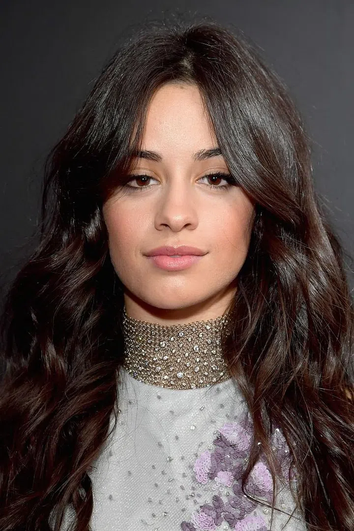 Camila went for a natural, effortless look so that it wouldn't compete with her Miri Couture embellished, lilac gown. She opted for sheer hydration and a pink flush with Burt Bee's Tinted Lip Oil in "Whispering Orchid". Photo: Getty 