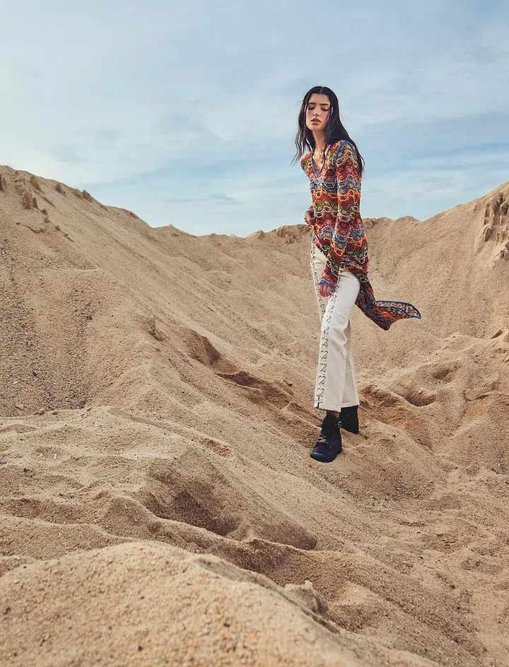 Dress, Etro. Bikini top; necklaces, Louis Vuitton. Jeans, H&M. Charm necklace, Dior. Boots, Coach. Necklace, model’s own (Photo: Phyllicia Wang)