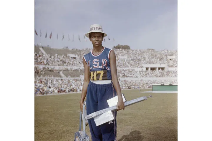 Wilma Rudolph, an American track and field racer who was considered the fastest woman alive in her time, wearing a straw hat and her team uniform at the Summer Olympics in Rome. Photo: Getty
