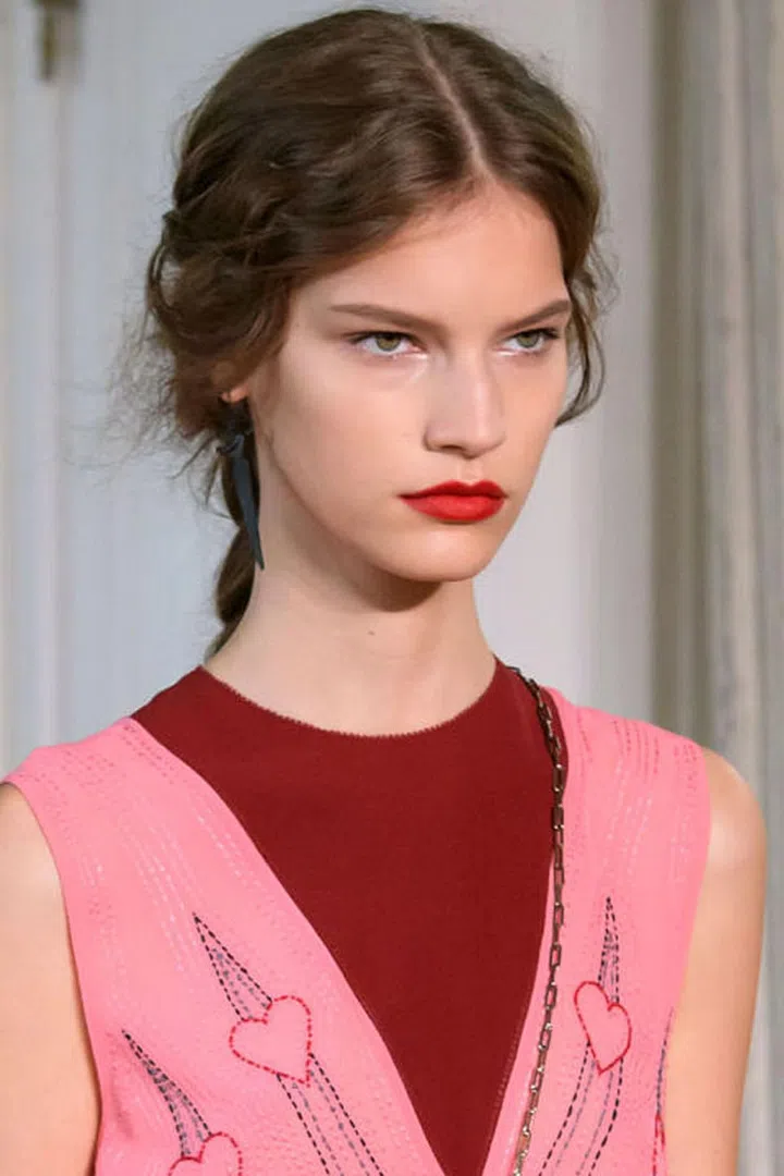 At Valentino, a handful of models walked the runway with a semi-matte red lip. 