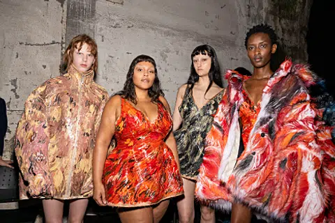 Paloma Elsesser and models backstage at Marni fall/winter 2024