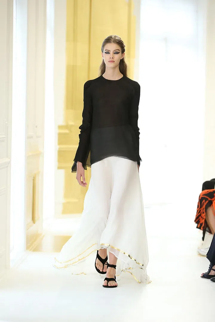 Black multilayered silk chiffon top with ecru multilayered silk chiffon skirt hemmed with gold leaf. Photo: Dior