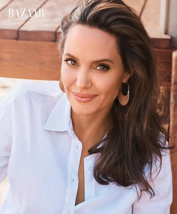 Gabriela Hearst blouse; Jolies own earrings. Photo: Alexi Lubomirski