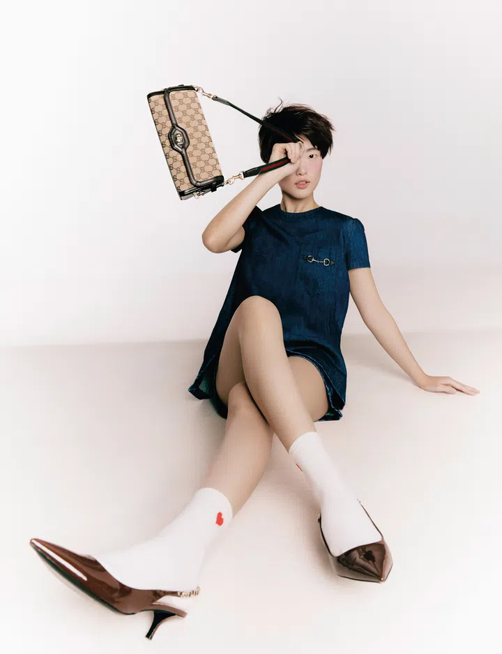 Dress; shorts; Gucci. Luce small shoulder bag; Gucci. Signoria slingback pumps,
Gucci. Socks, stylist’s own